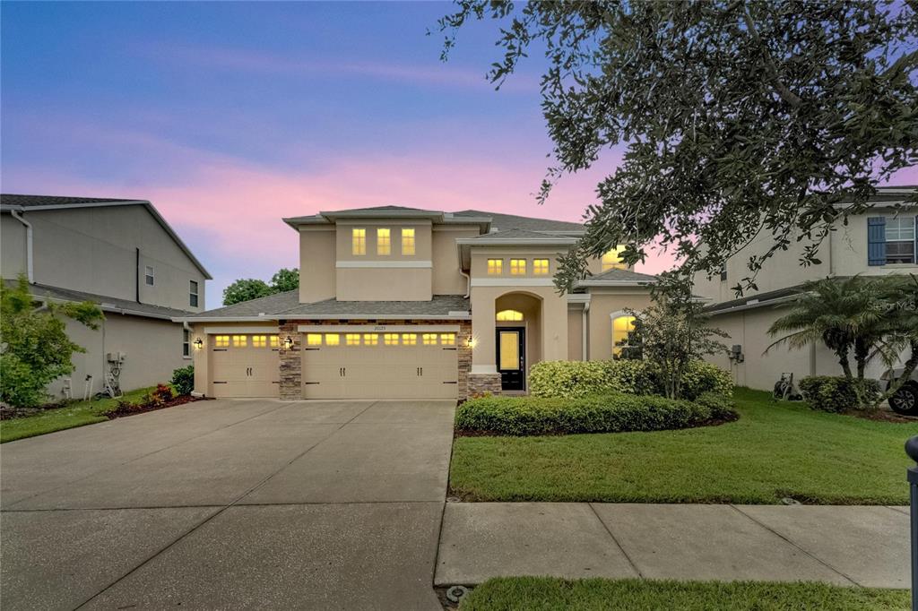 a front view of a house with a yard