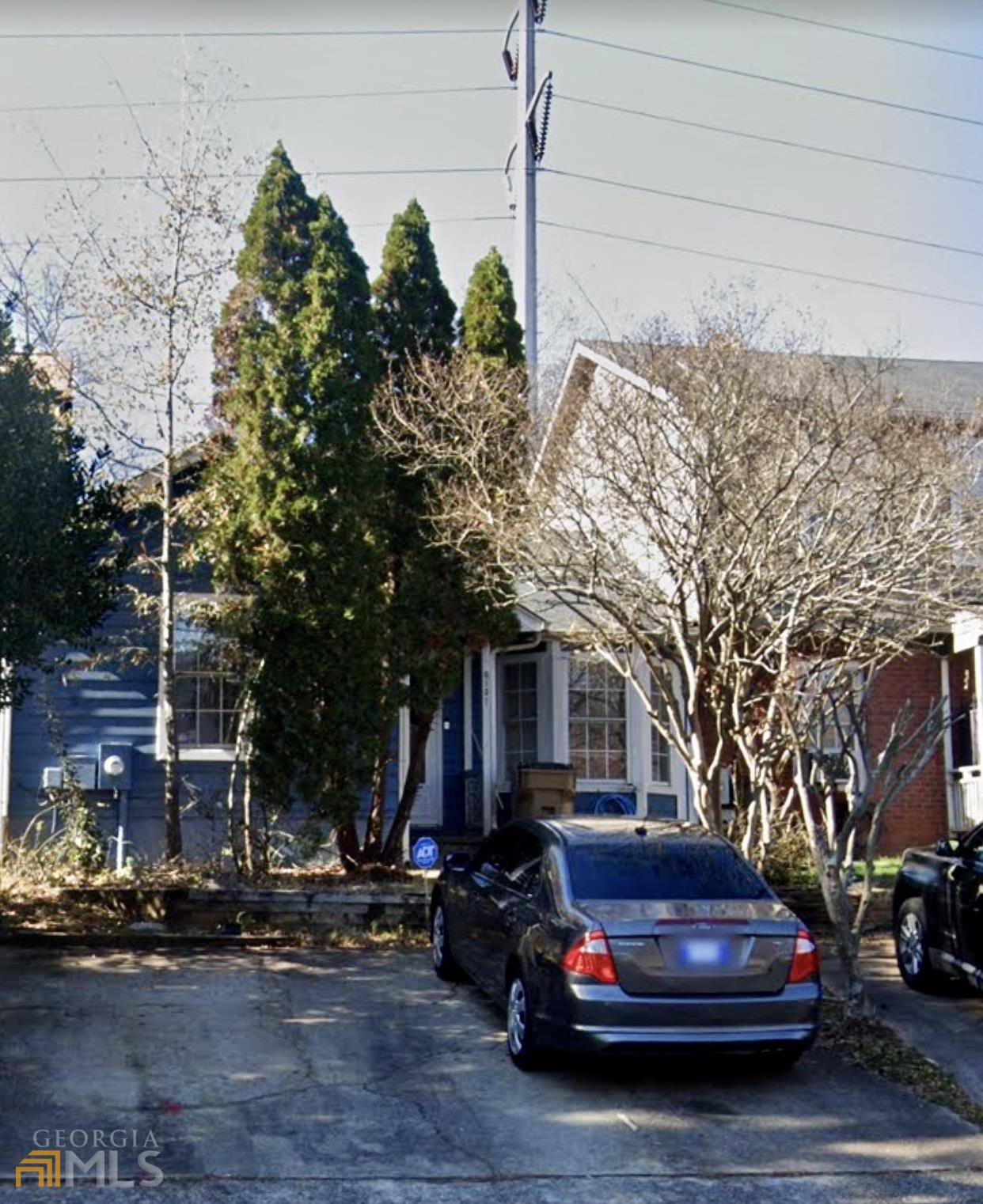 a car parked in front of a house