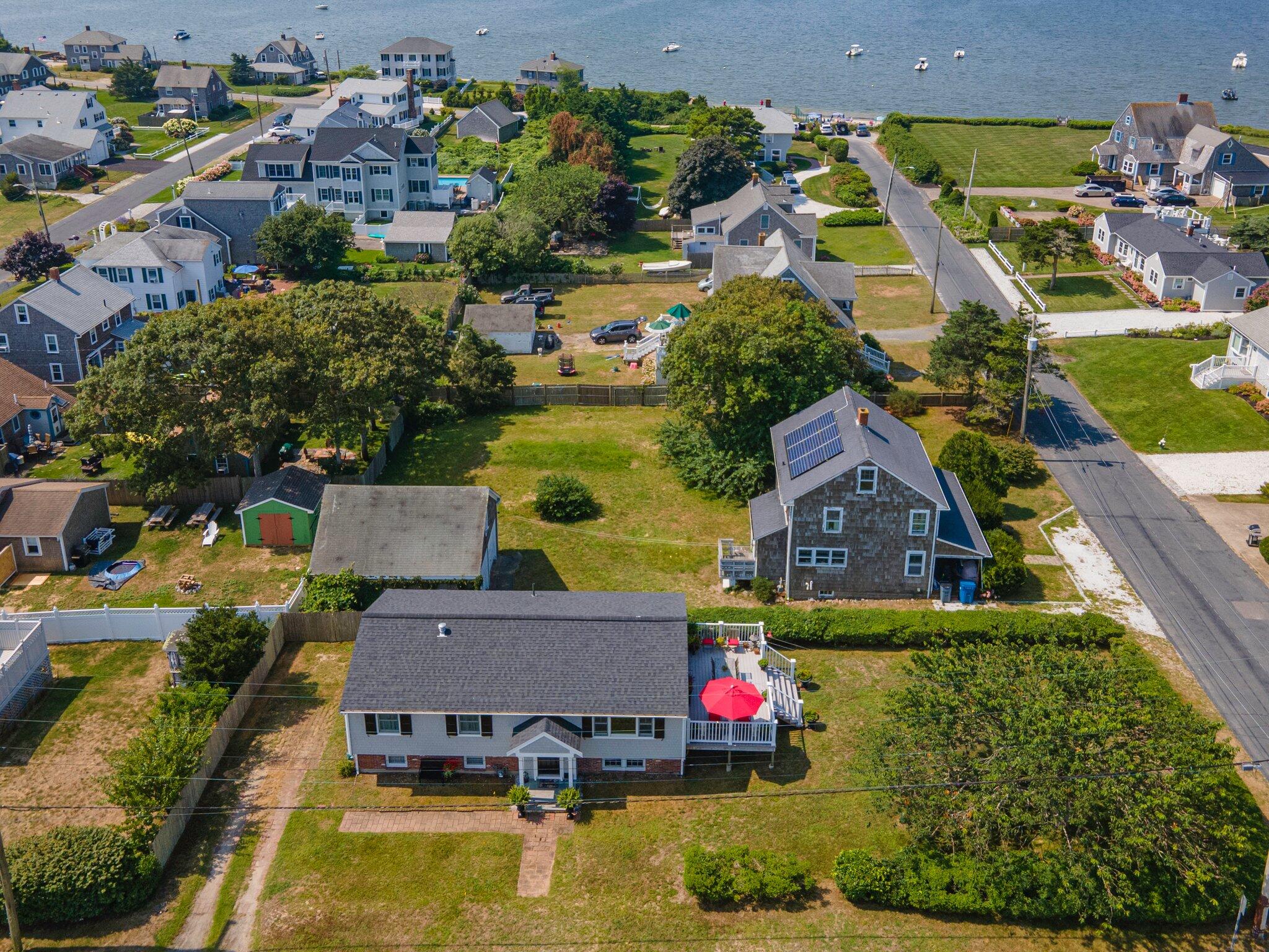 an aerial view of a house with a swimming pool