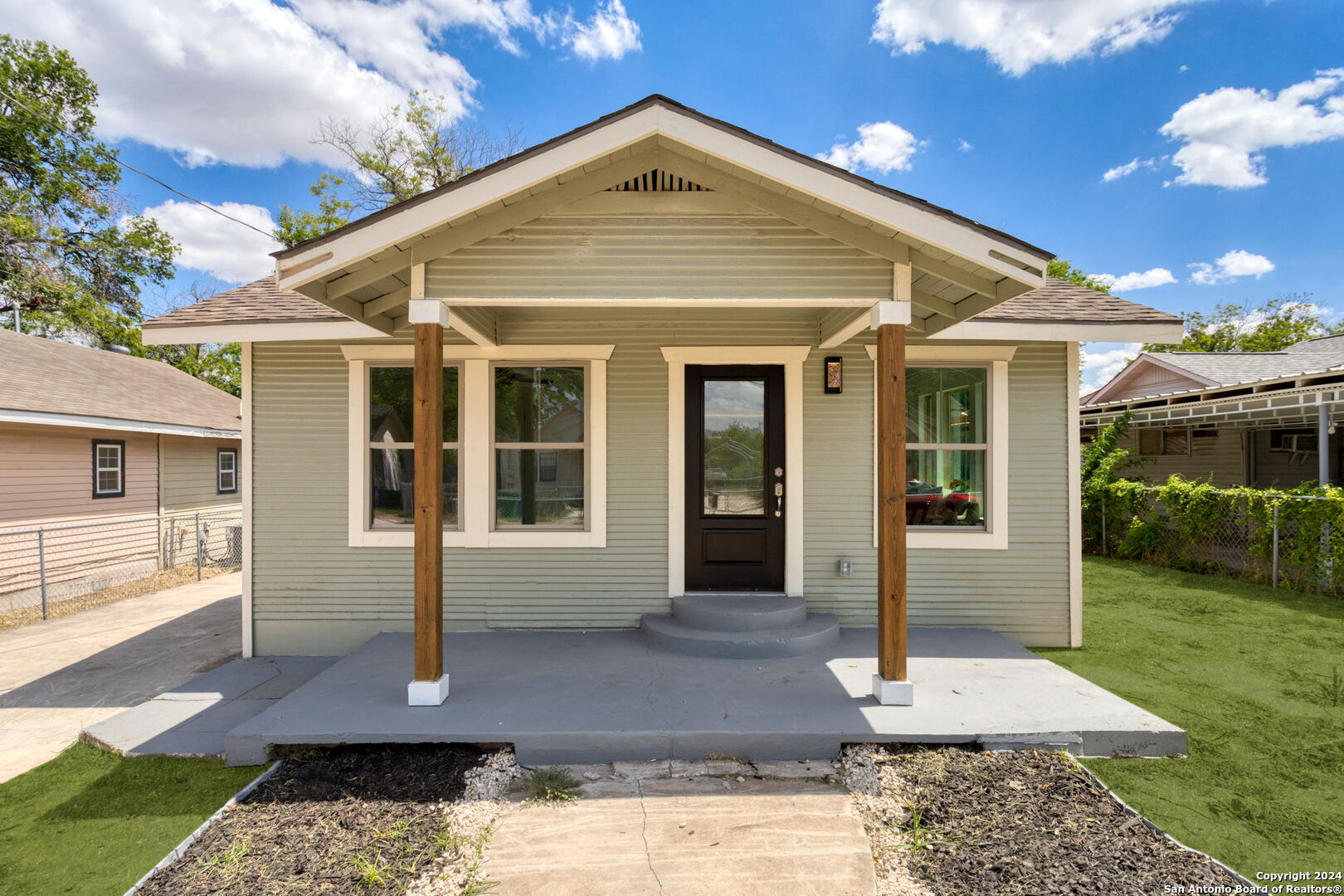 a front view of a house with garden