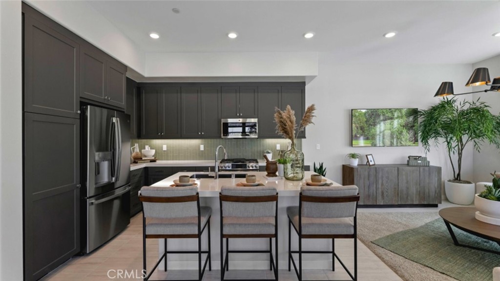 a kitchen with a table and chairs in it