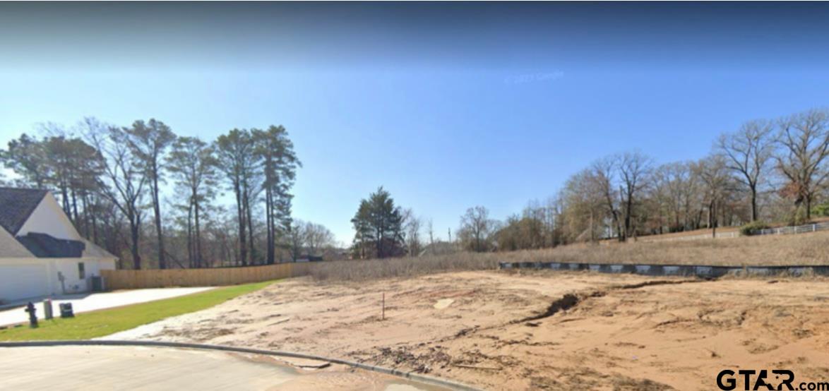 a view of dirt yard and covered with snow