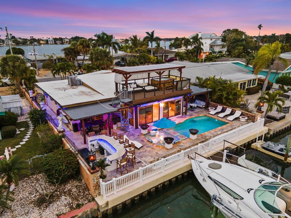 an aerial view of a house with roof deck