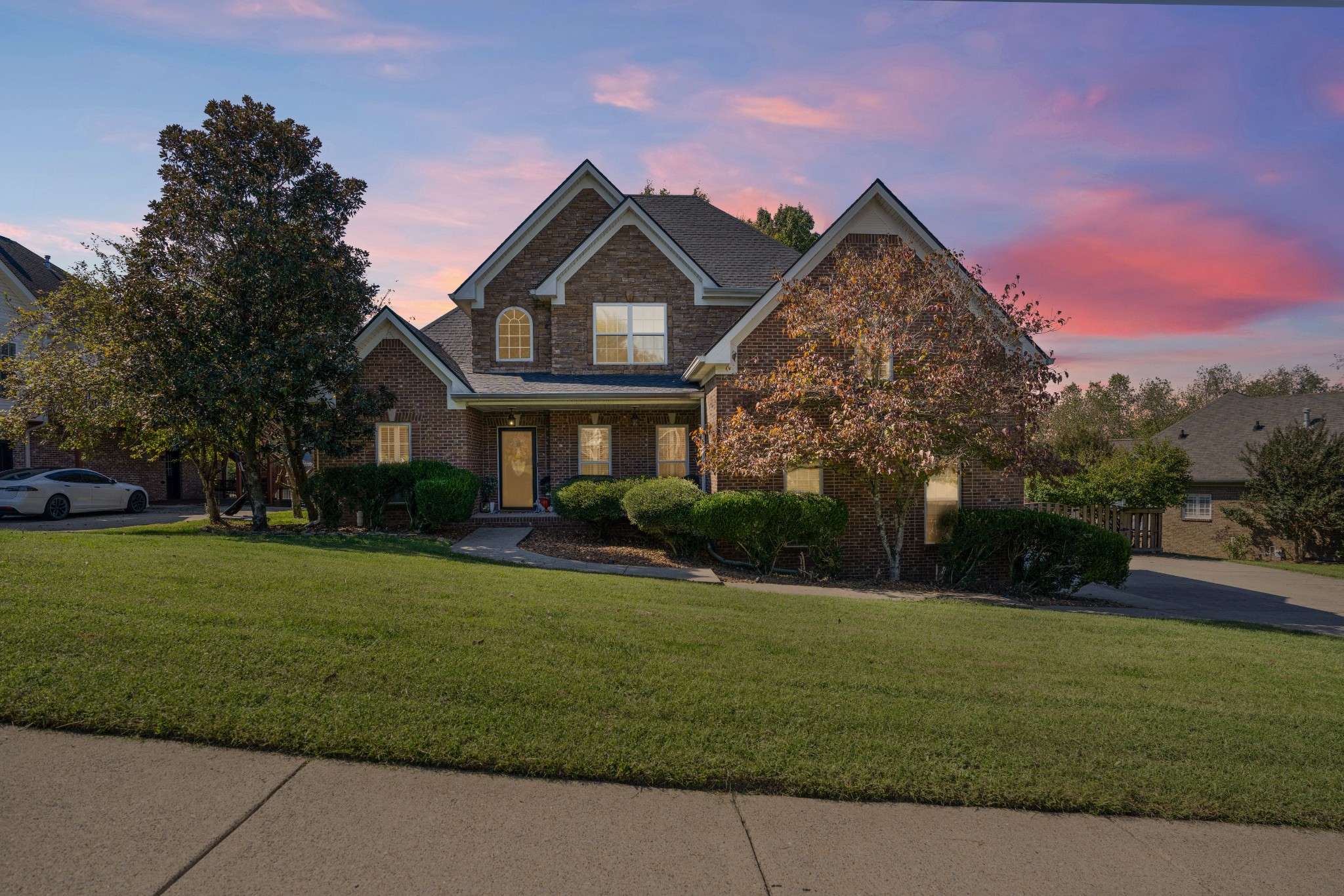 a front view of a house with a yard