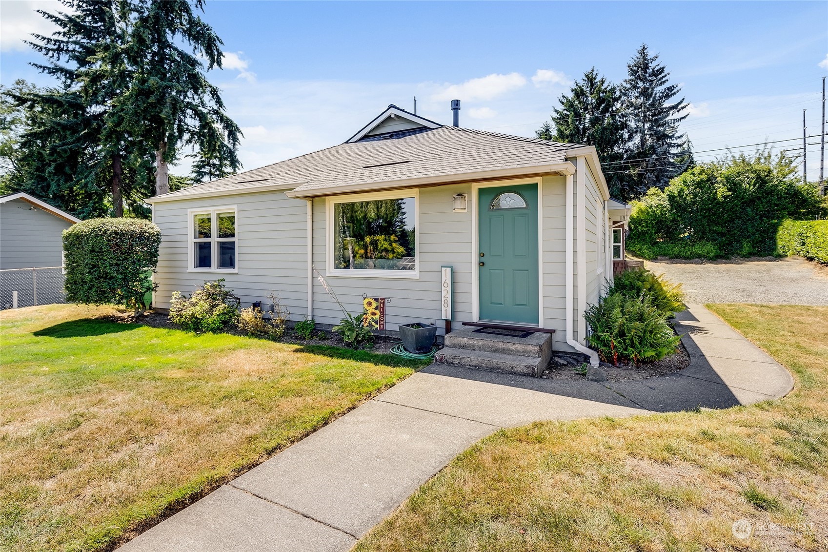 a front view of a house with garden