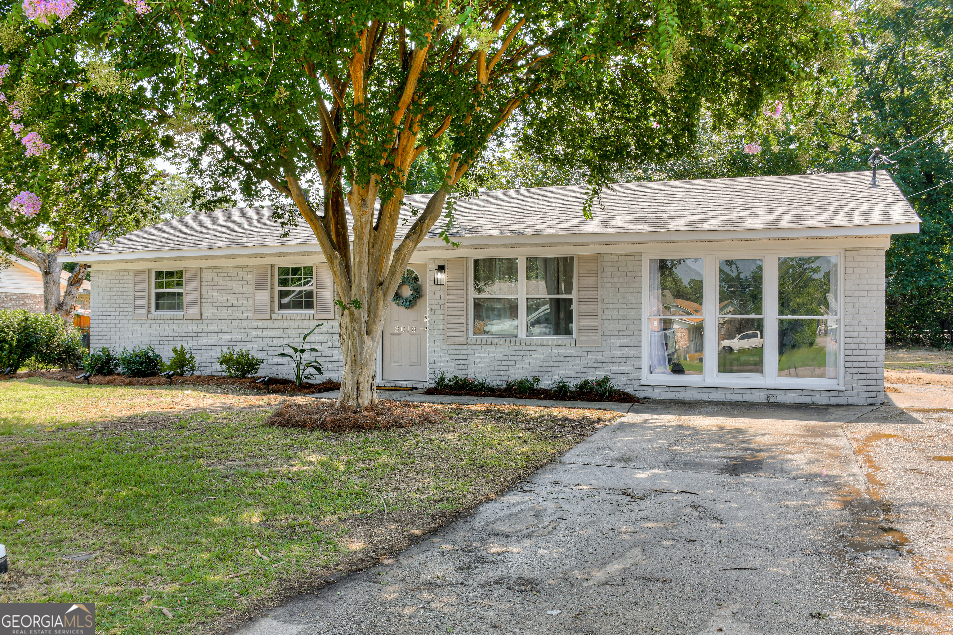 front view of a house and a yard