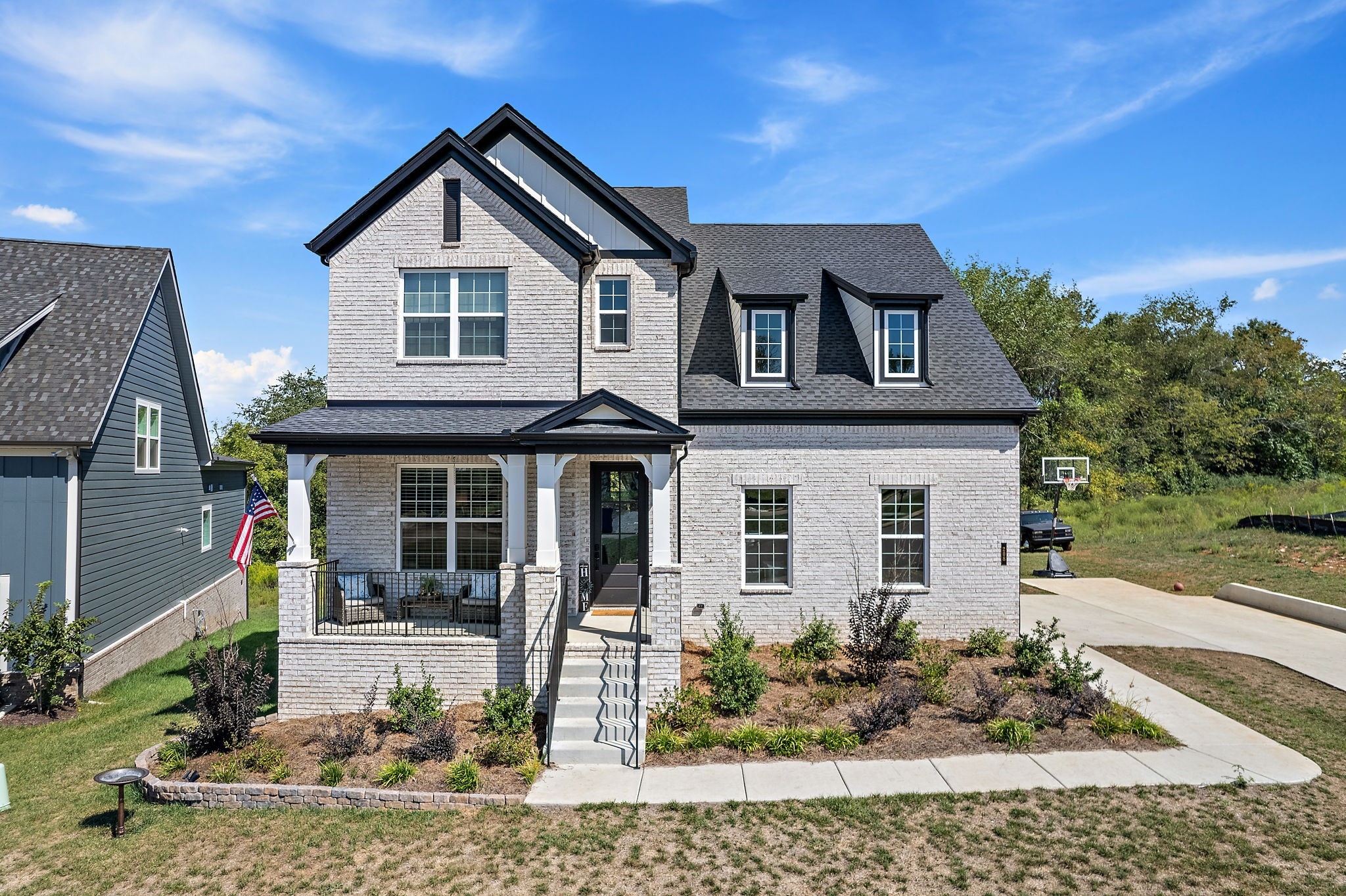 a front view of a house with garden