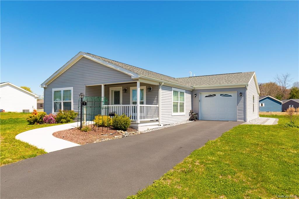 a house with yard in front of it