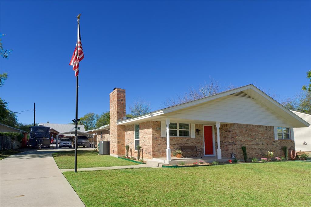 a front view of a house with a yard