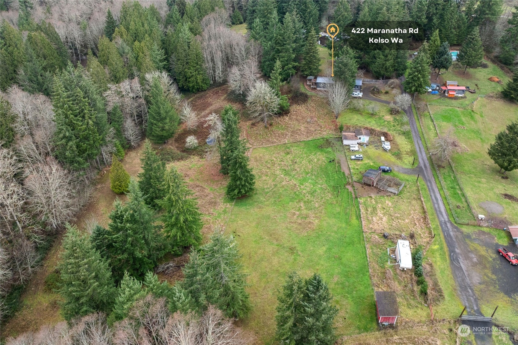 an aerial view of residential houses with outdoor space