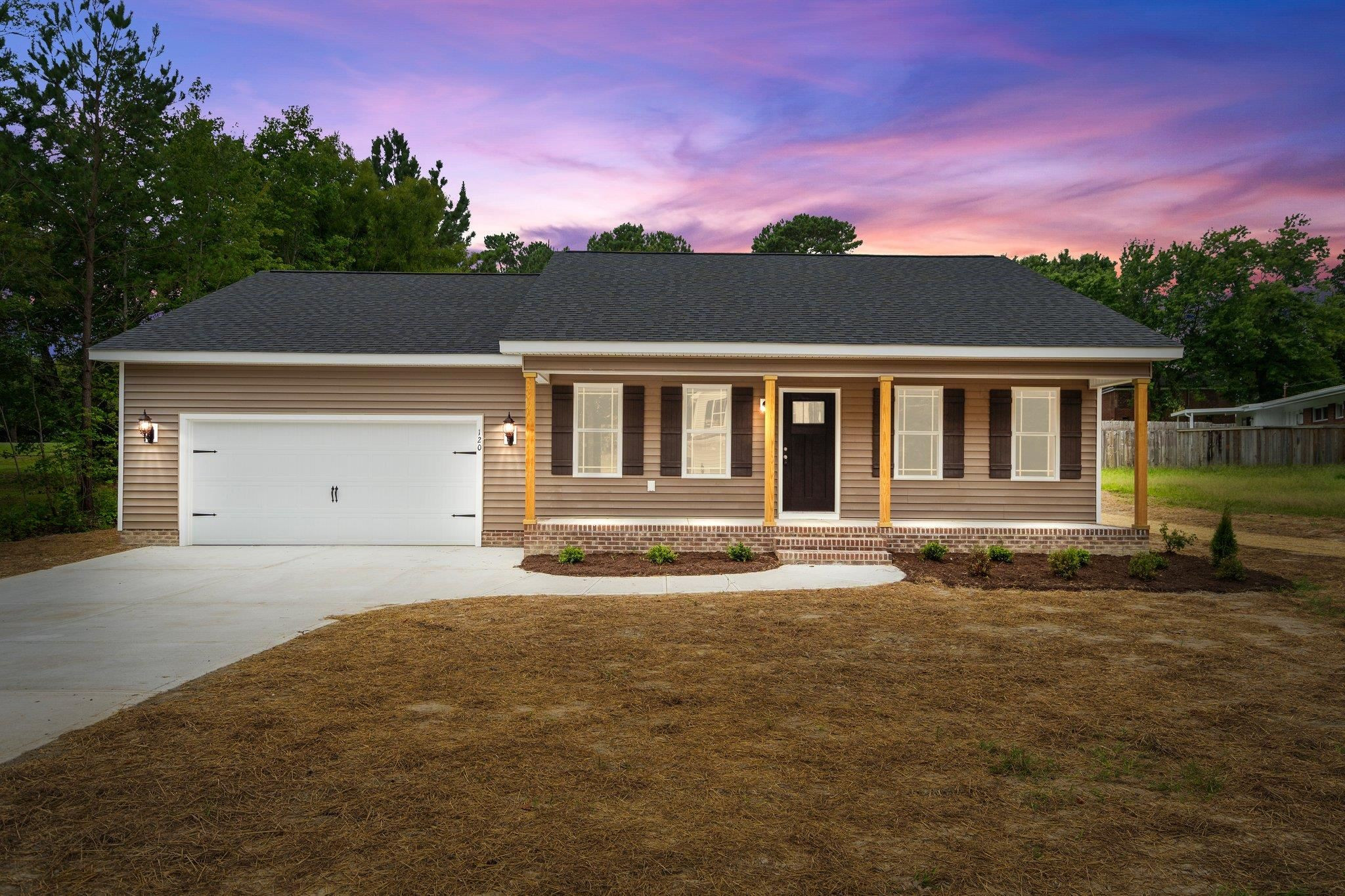 a front view of a house with a yard