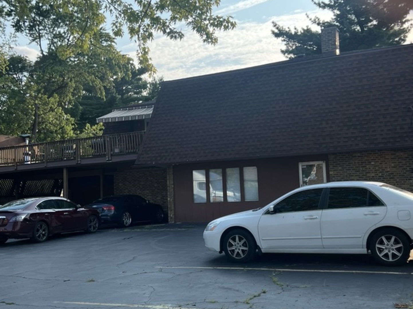 a front view of a house with parking space