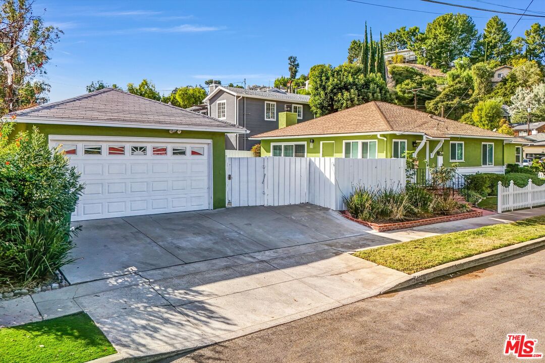 a front view of a house with yard