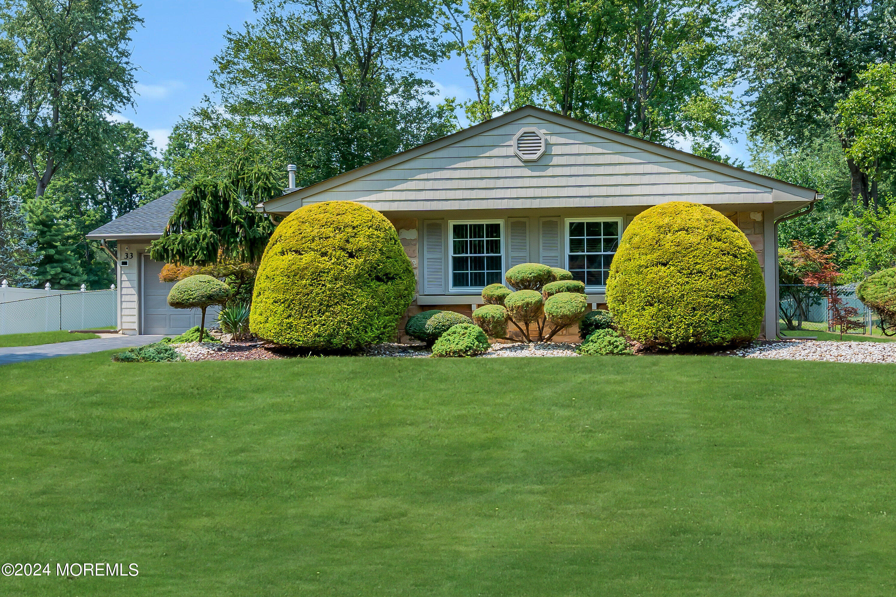 a front view of house with garden