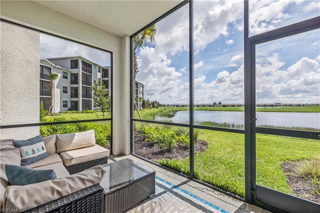 Sunroom / solarium with a water view