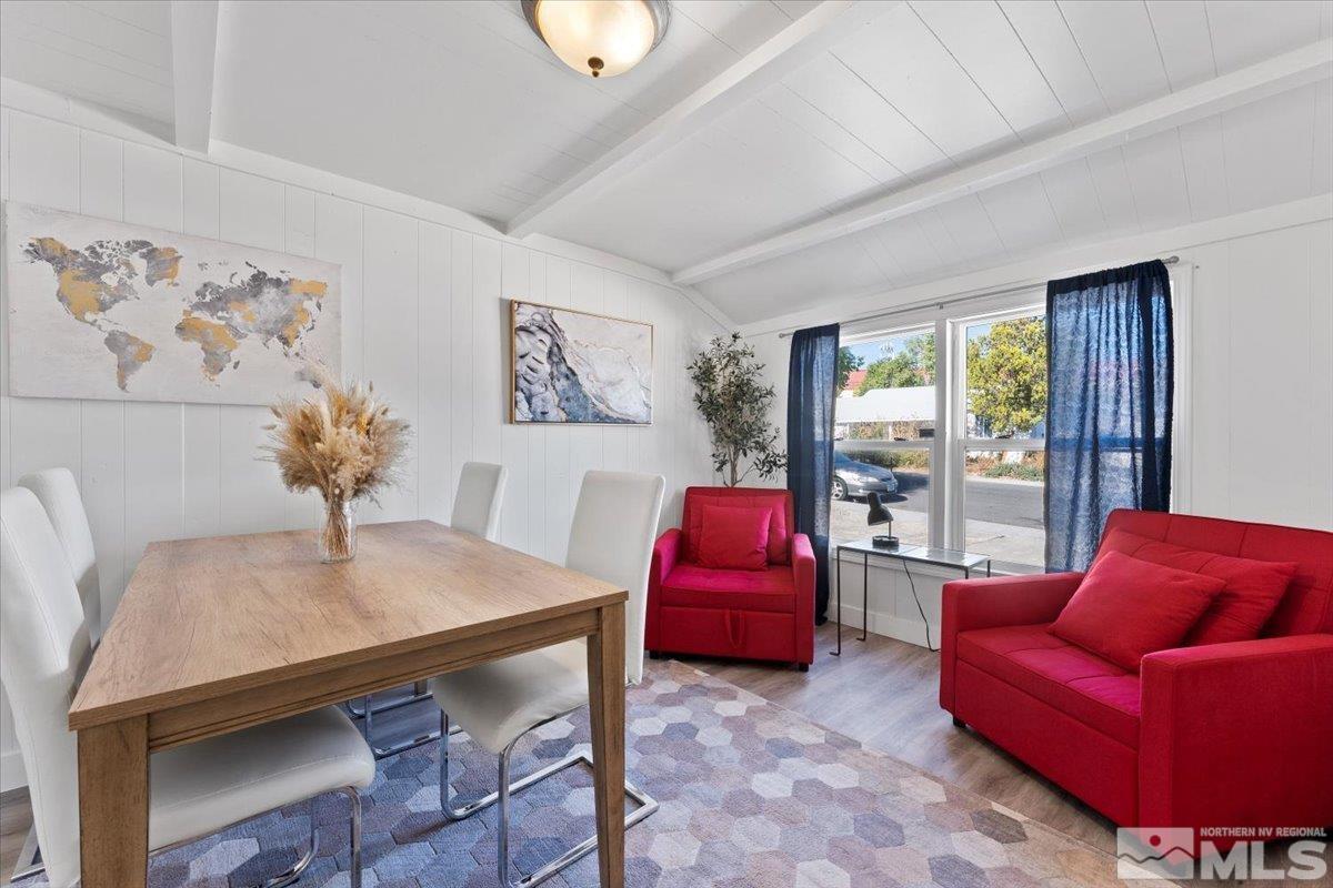 a living room with furniture a couch and a potted plant