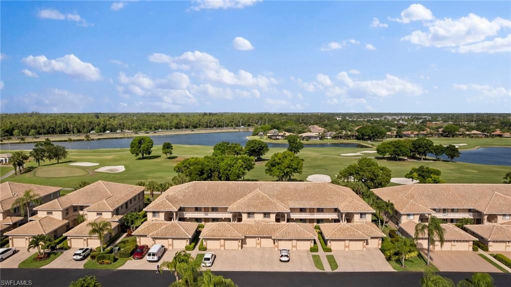 an aerial view of a house with a lake view