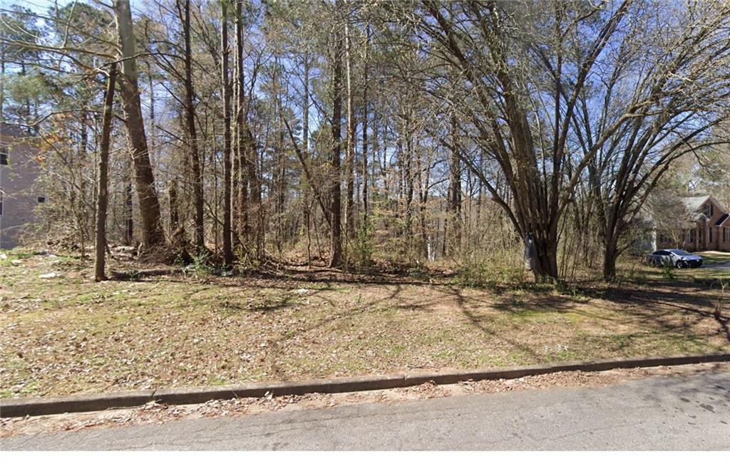 a view of a backyard of the house