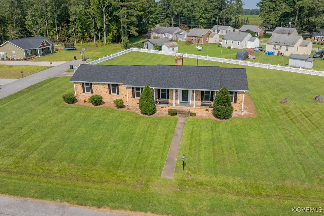 a aerial view of a house with a yard