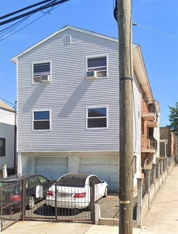 a front view of a house with parking