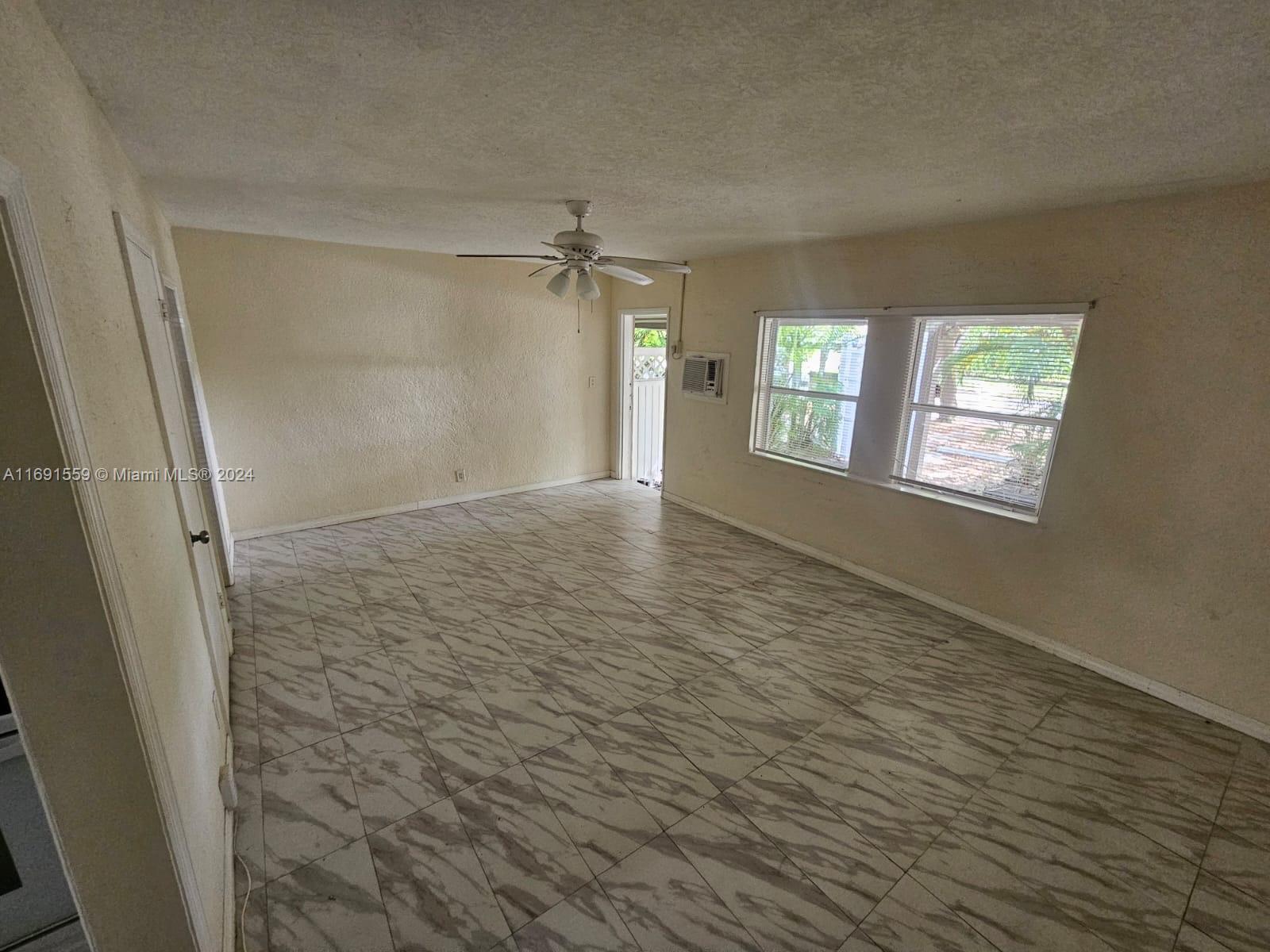 a view of an empty room and window