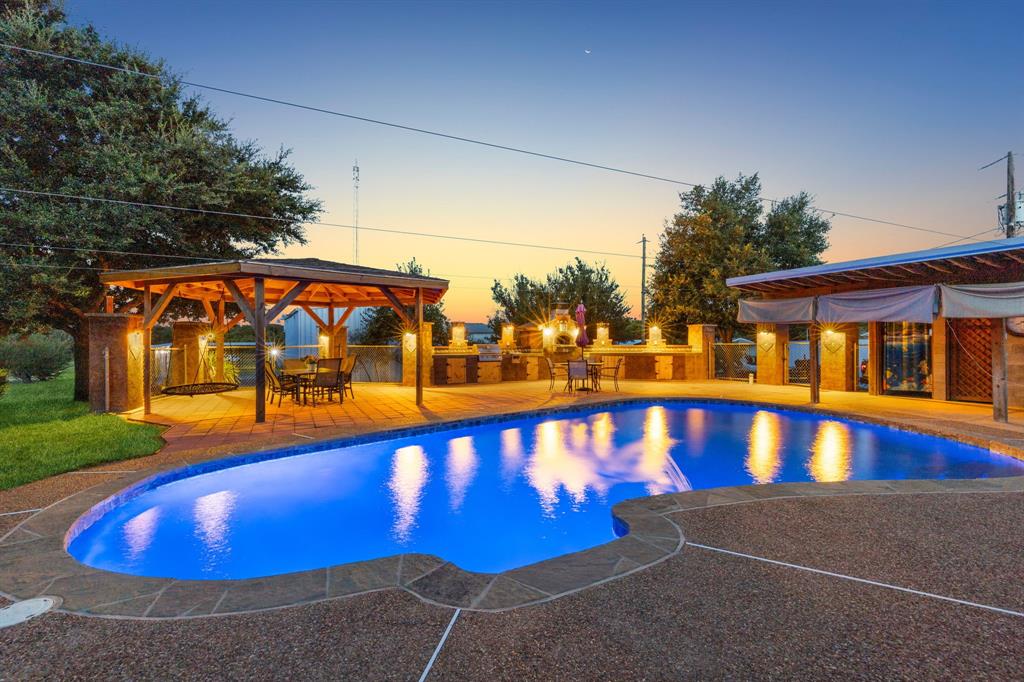 a view of swimming pool with a yard