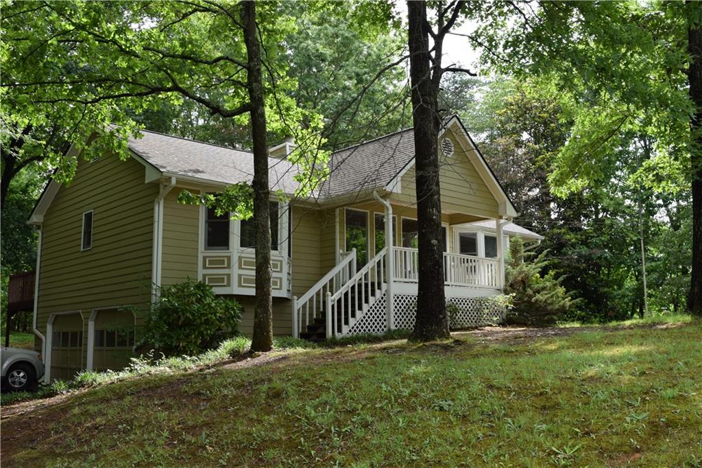 front view of a house with a tree