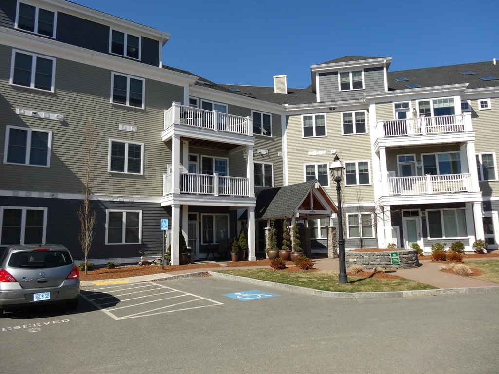 a front view of a building with street view