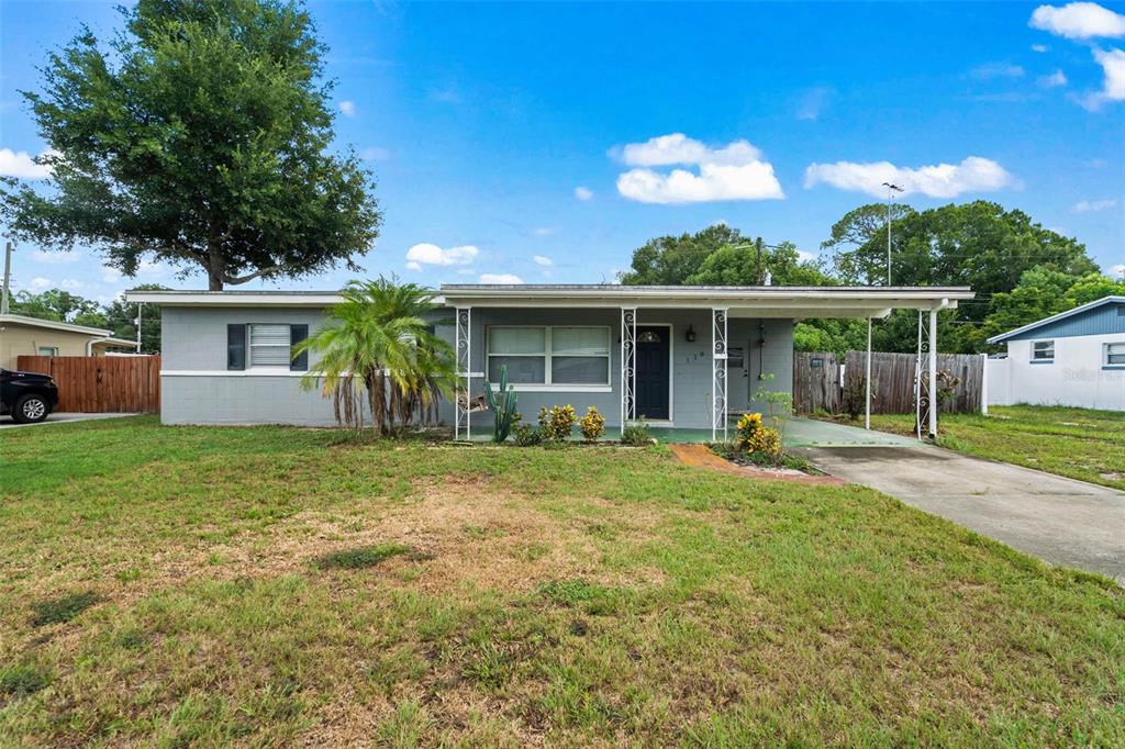 front view of a house with a yard