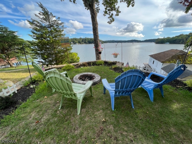 a view of a chairs in a backyard