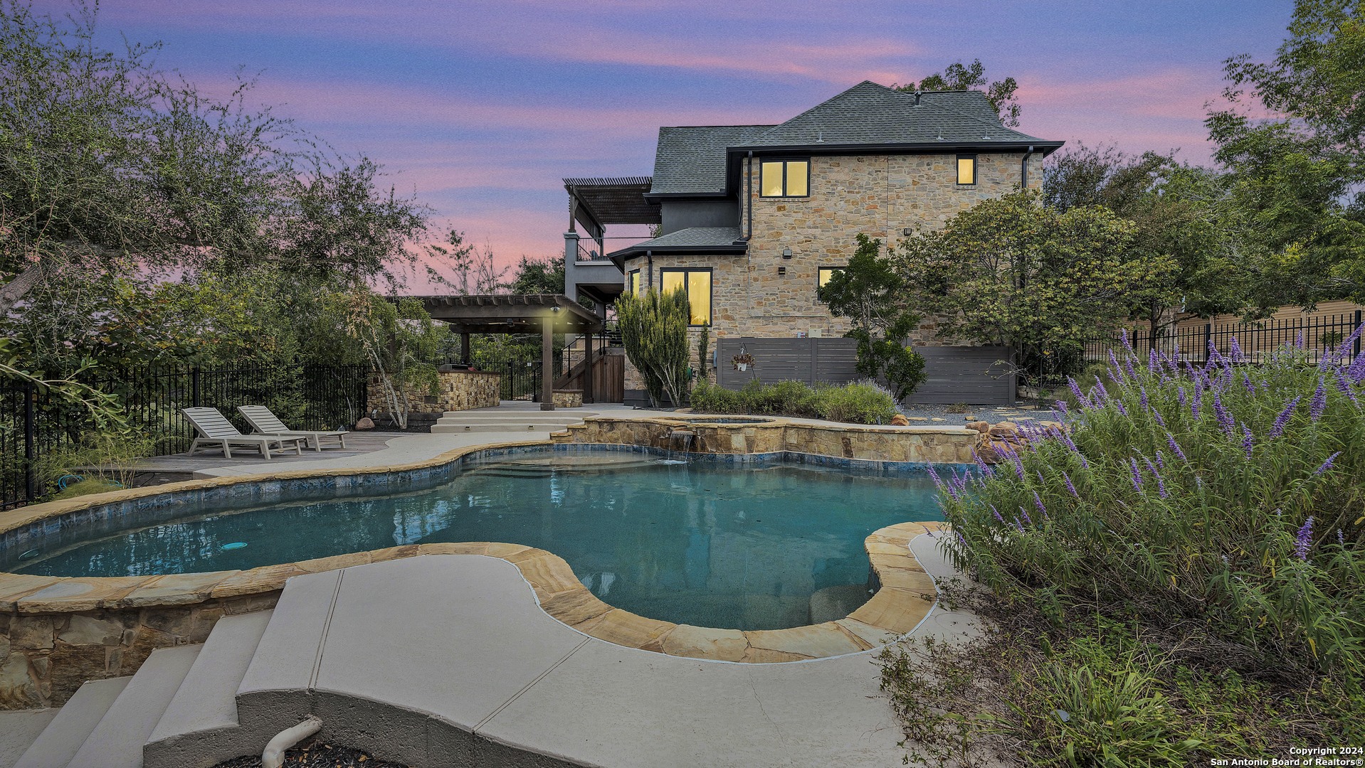 a view of a swimming pool with a garden