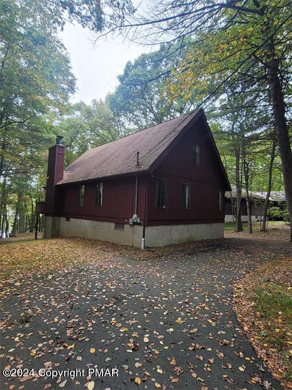 a house with a tree in the background