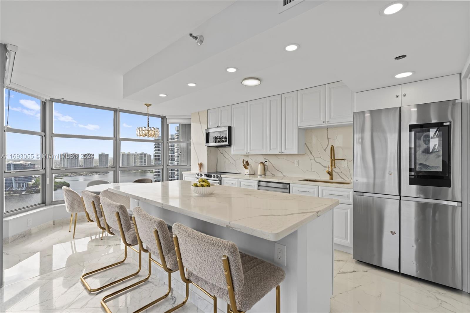 a kitchen with appliances cabinets and a counter top space