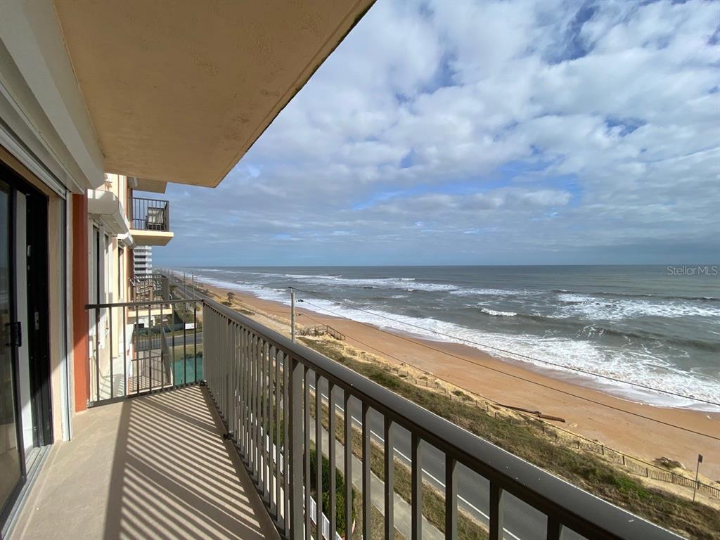 a view of a balcony with an outdoor space