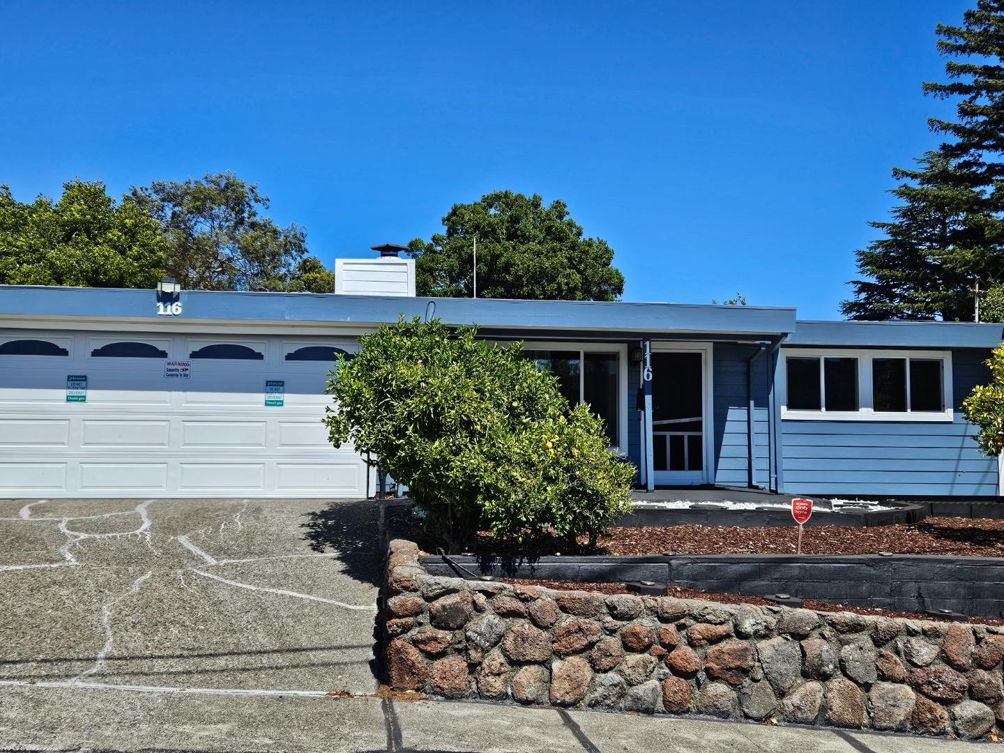 front view of a house with a small yard