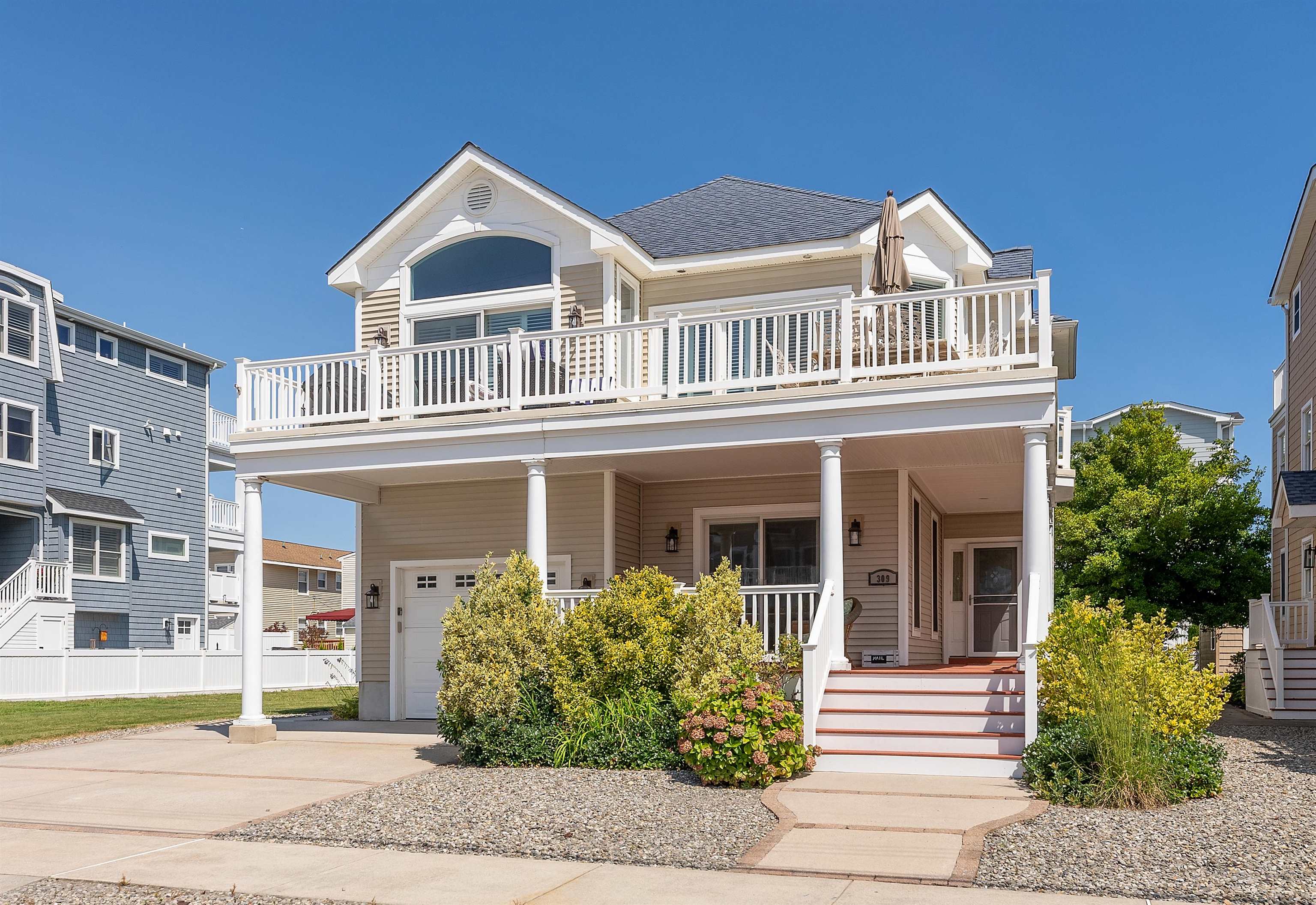 a front view of a house with garden