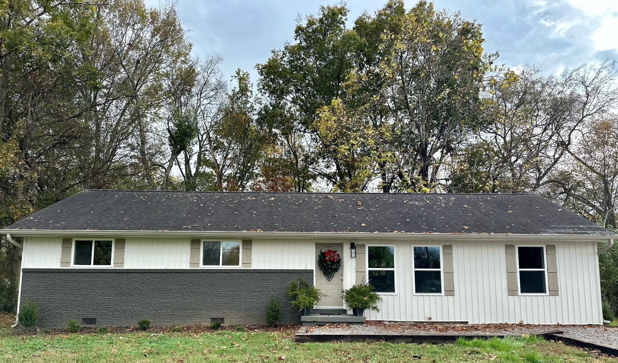 a front view of a house with a yard