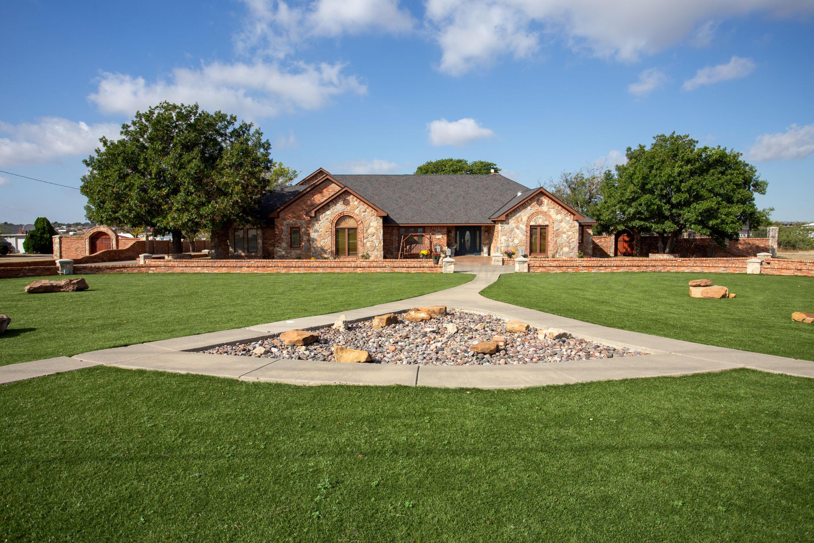 a view of an house with backyard space and garden