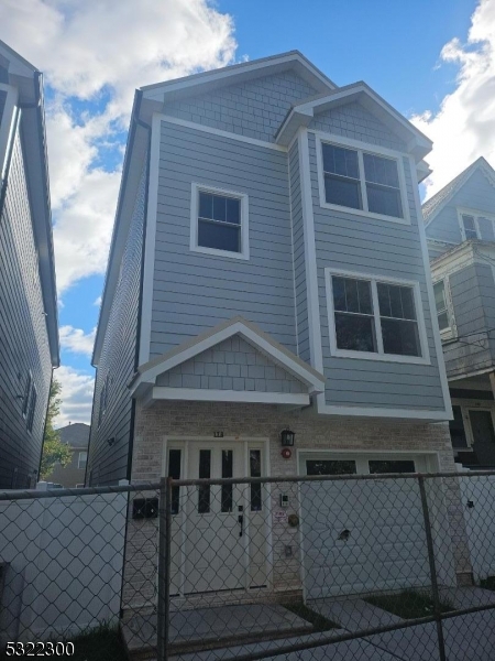 a front view of a house with garage