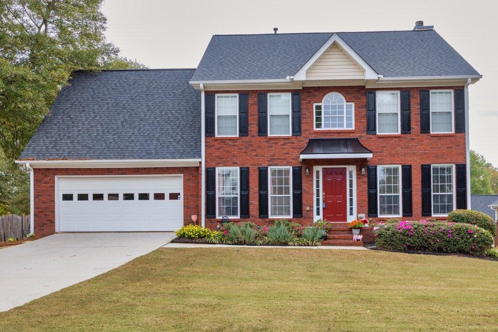 front view of a house with a yard