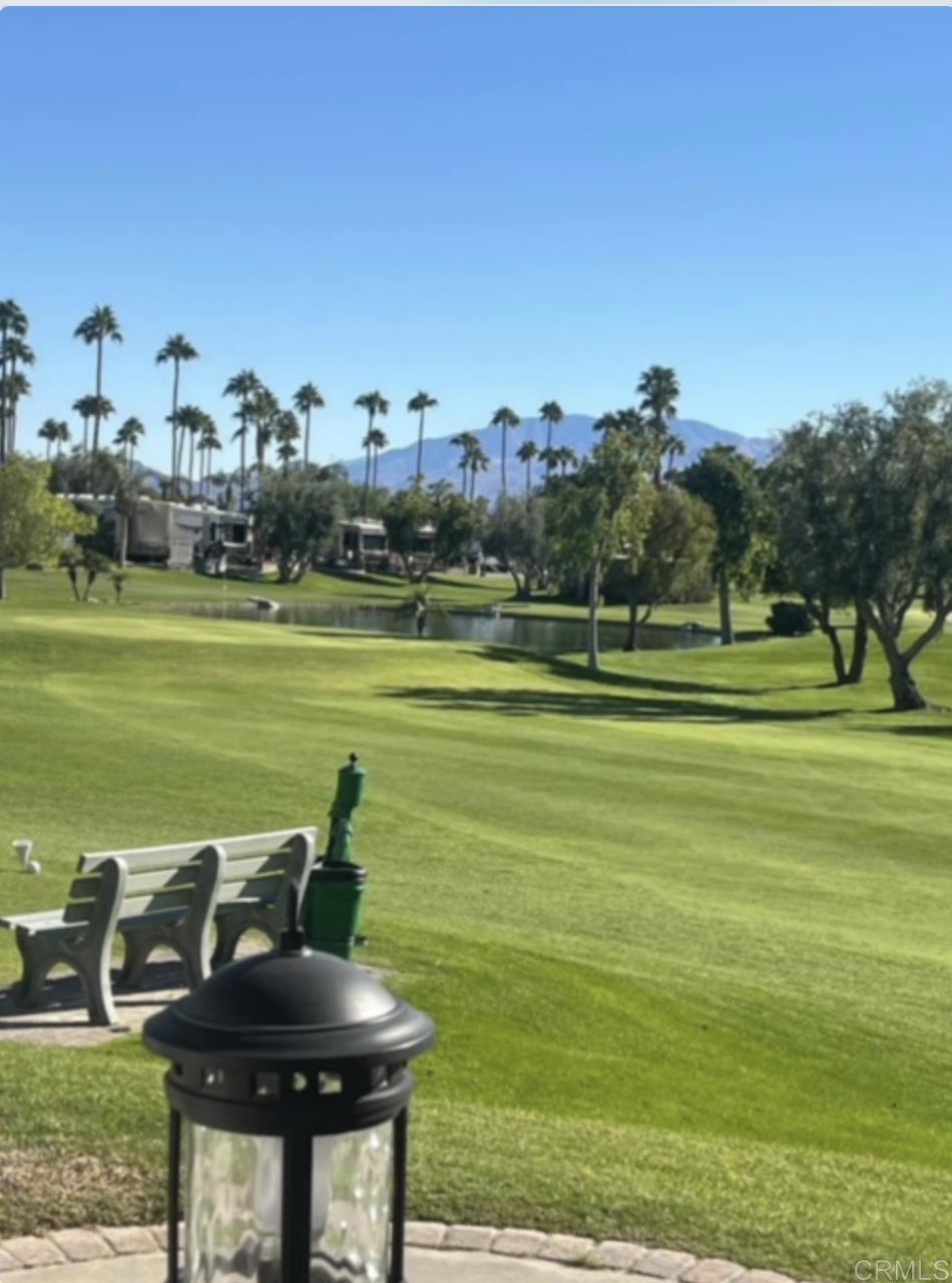 a view of a golf course with chairs