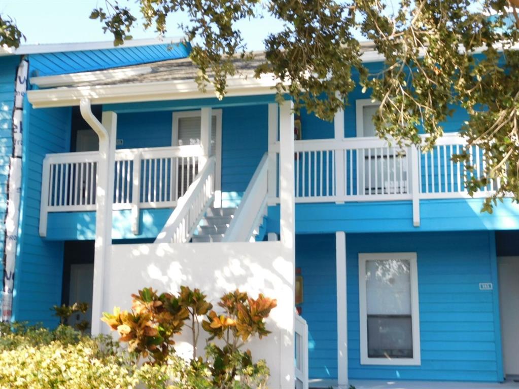 a view of a house with a small yard