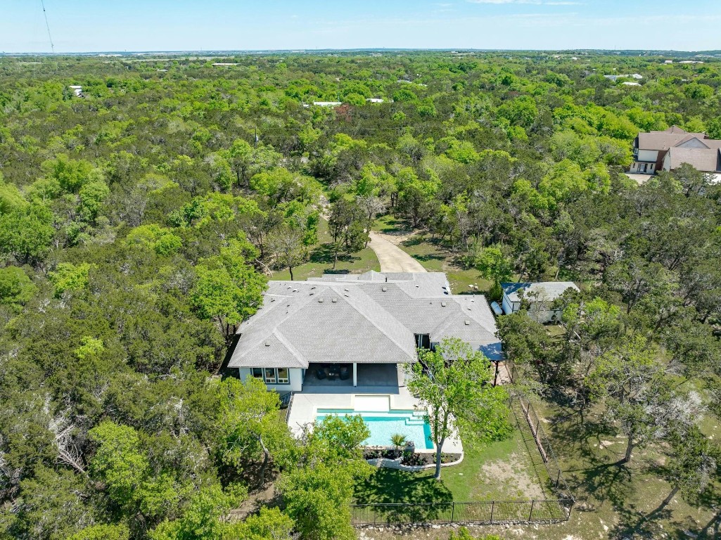 This stunning home sits on 3.15 acres of scenic beauty, offering luxury, comfort, and outdoor entertainment; and backs to 449 acre Travis County Nature Preserve.