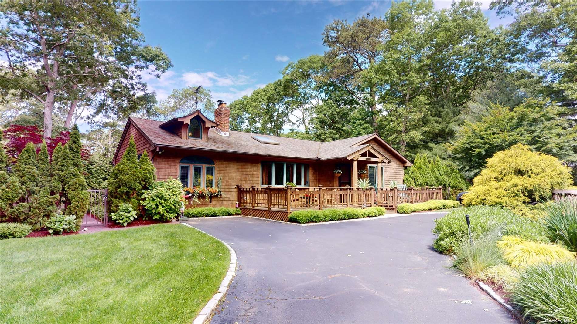 a front view of a house with a yard and porch