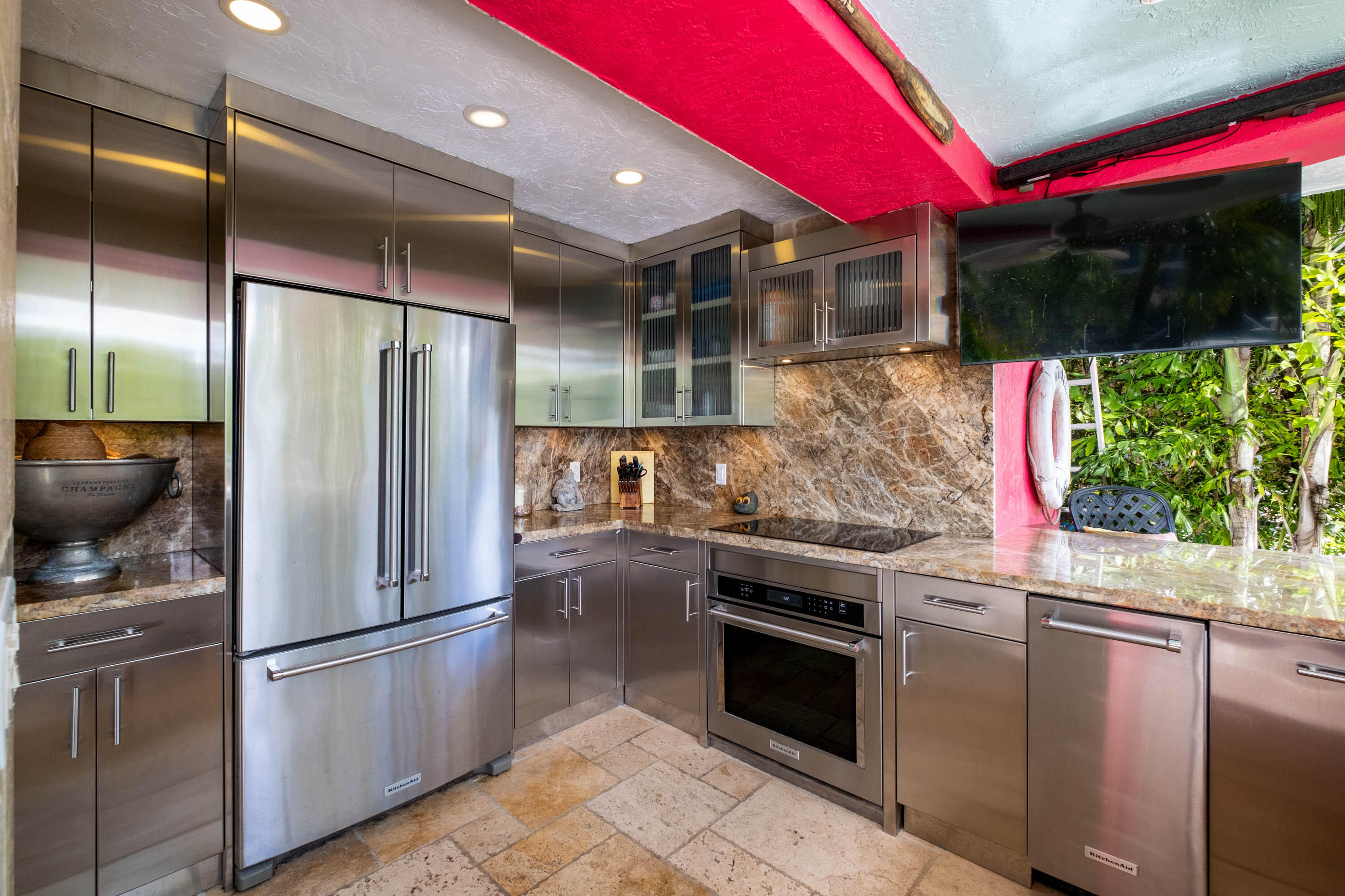 a kitchen with stainless steel appliances granite countertop a refrigerator and a stove