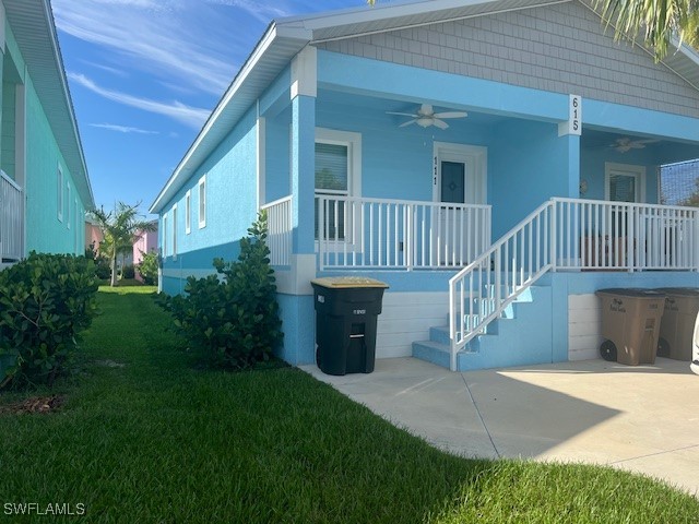 a view of a house with a deck and a yard