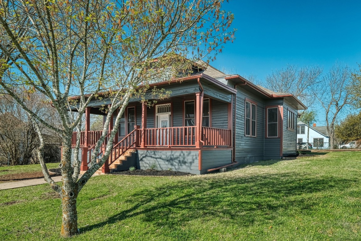 Welcome home! This remodeled historic home  sits on a large lot with mature trees and has an inviting large covered front porch.