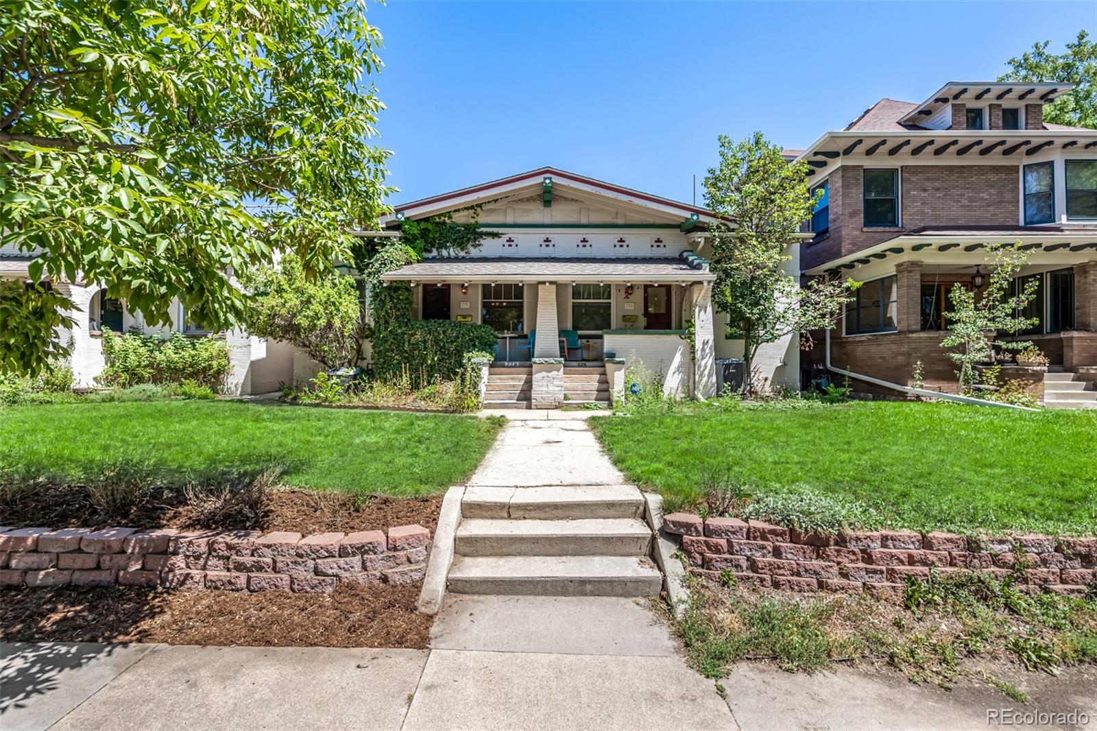 front view of a house with a yard