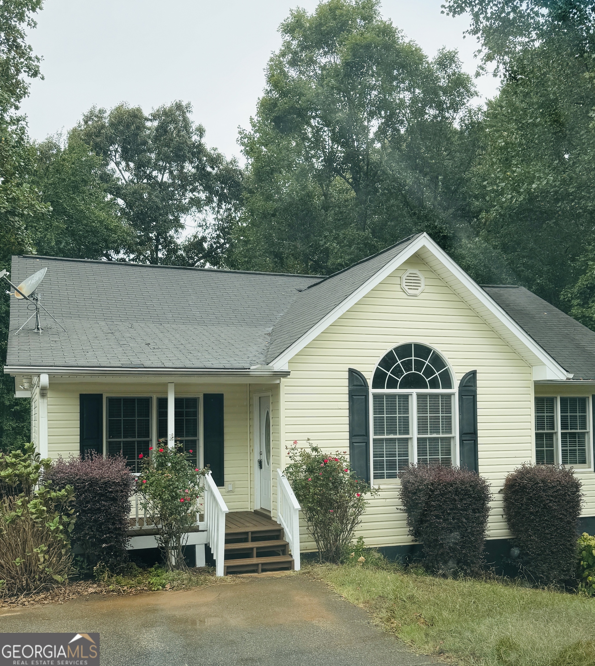 front view of a house with a yard