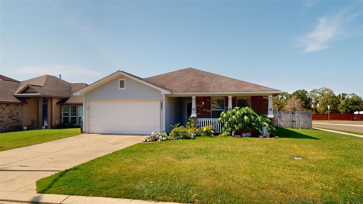 Ranch-style home featuring covered porch, a front